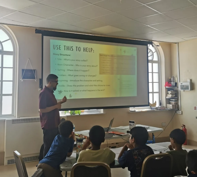 Umair delivering workshop - story structure