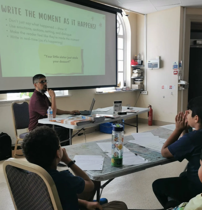 Umair delivering workshop - writing in the moment